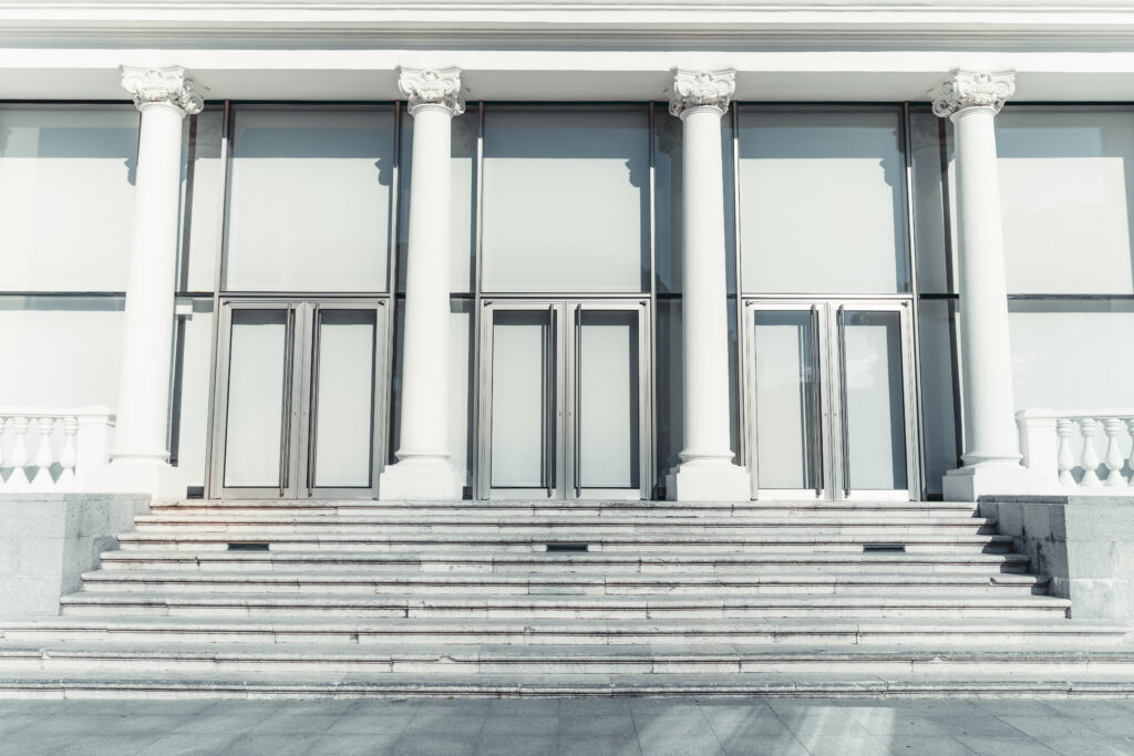 White stone columns symbolizing the four pillars of a successful sales methodology rollout in a CRO's decision guide
