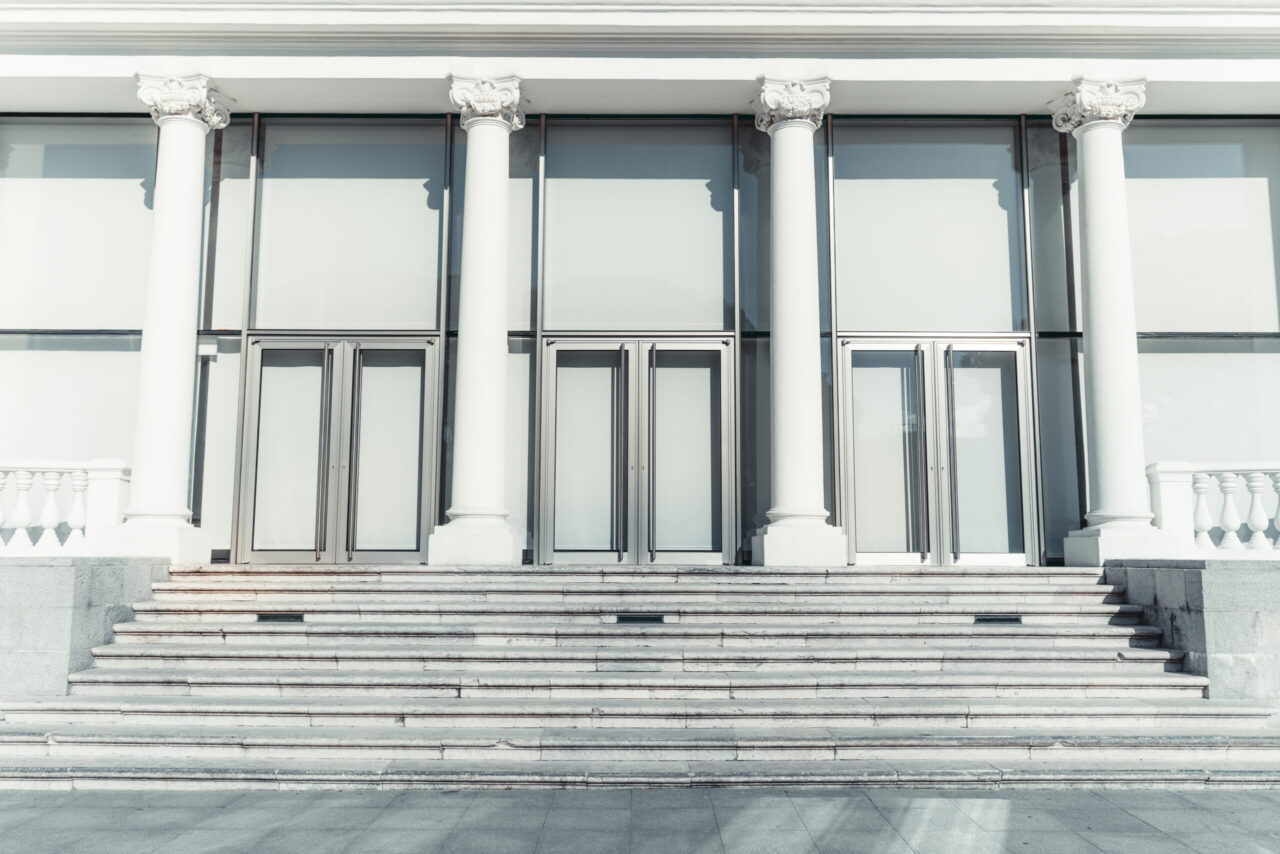 White stone columns symbolizing the four pillars of a successful sales methodology rollout in a CRO's decision guide