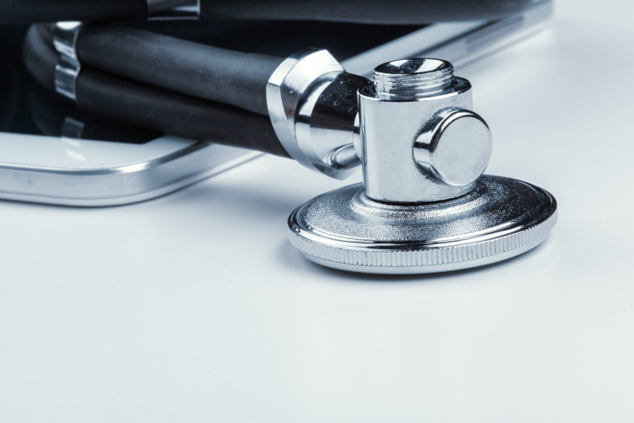 Stethoscope resting on a digital tablet, representing healthcare and medical sales