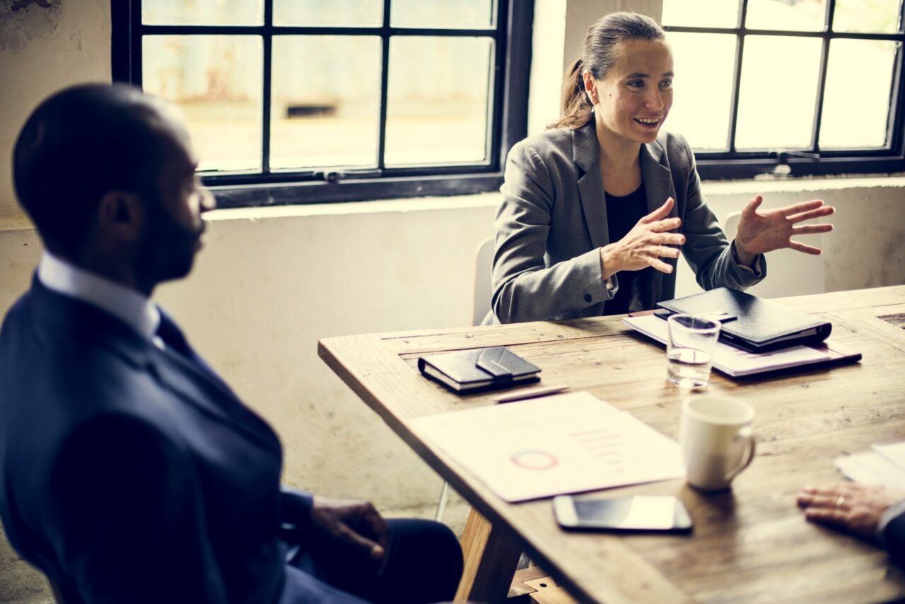 Group of professionals collaborating around a table in a business meeting