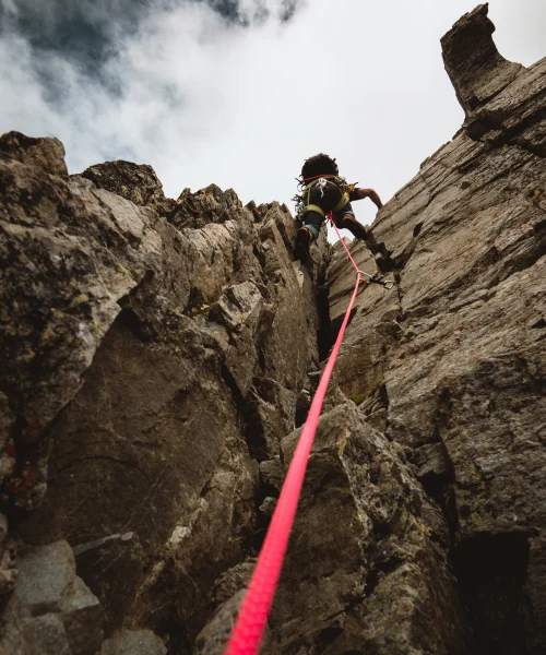 vertical-shot-of-a-person-rock-climbing-on-a-cloud-2025-02-12-00-03-39-utc